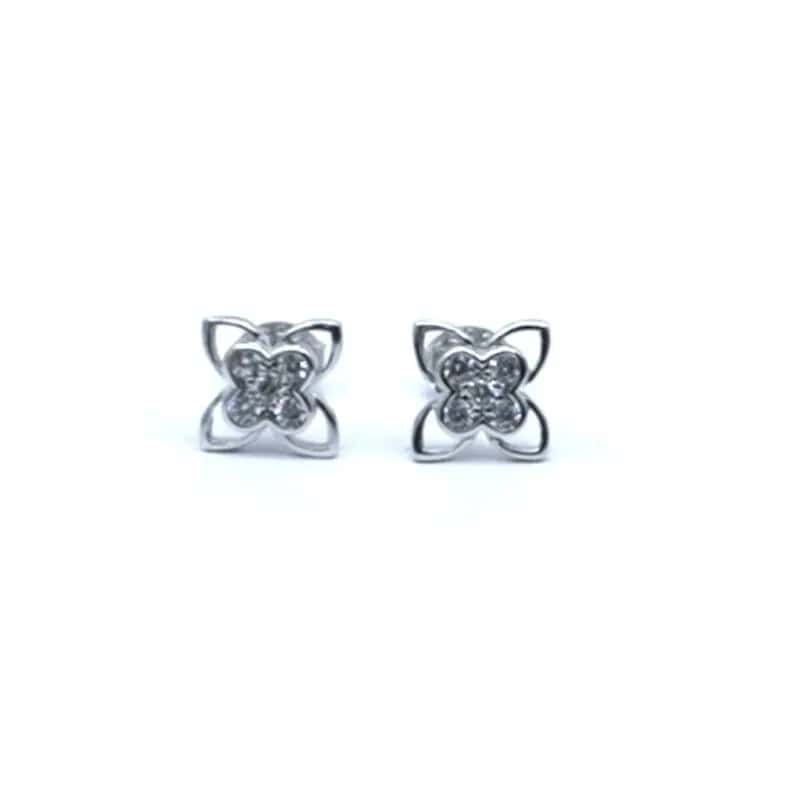 Pendientes de flor de plata con piedras blancas